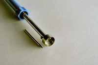 Tool Creates Filler Hole in Empty Cartridge